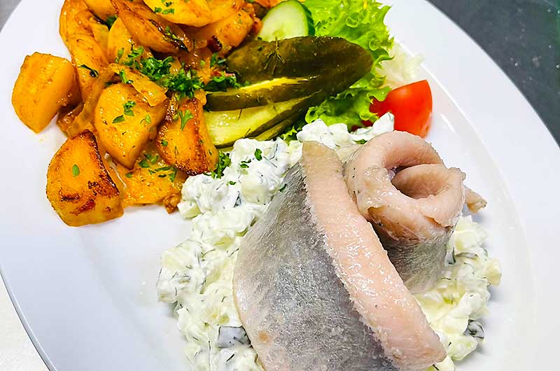 Pickled herring with fried potatoes