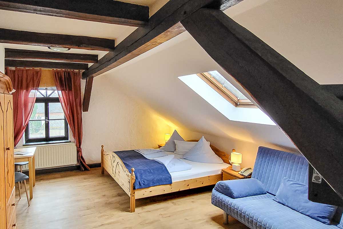 Wood beam ceiling in the double room at the Hofschänke